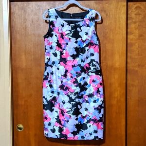 Worn once for wedding, lovely flowered form-fitting dress. Size 10